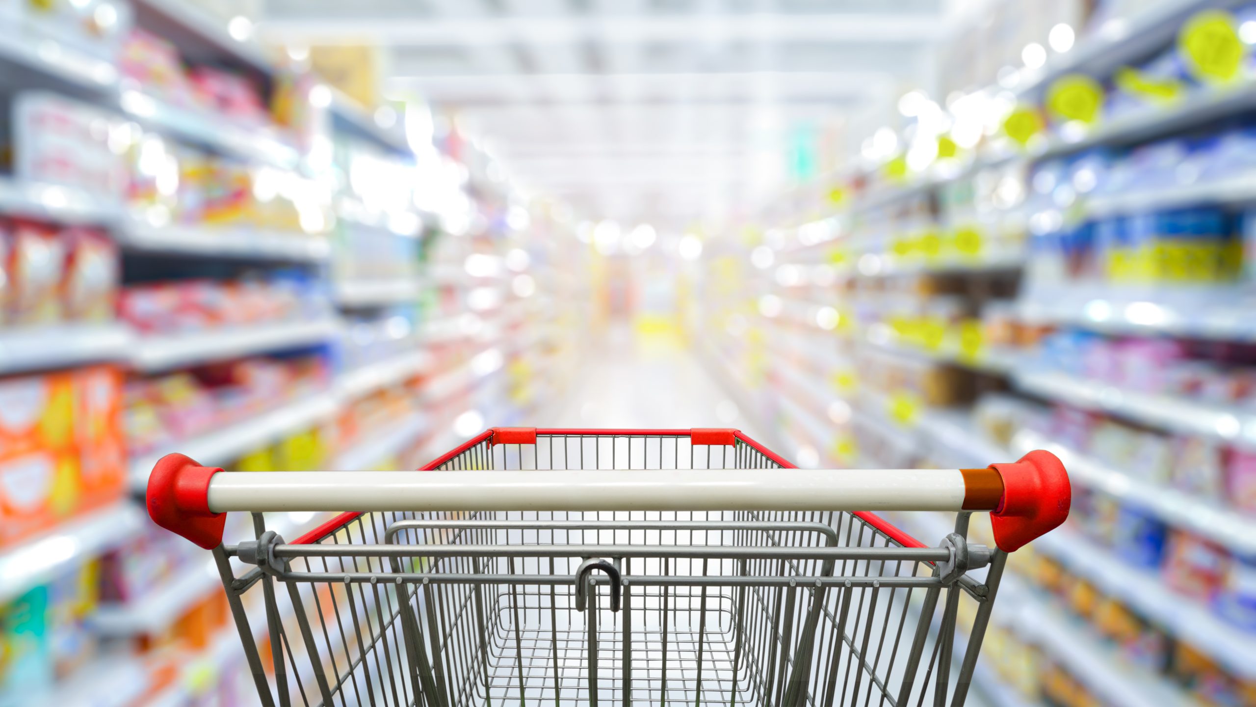 Supermarket,Aisle,With,Empty,Red,Shopping,Cart.