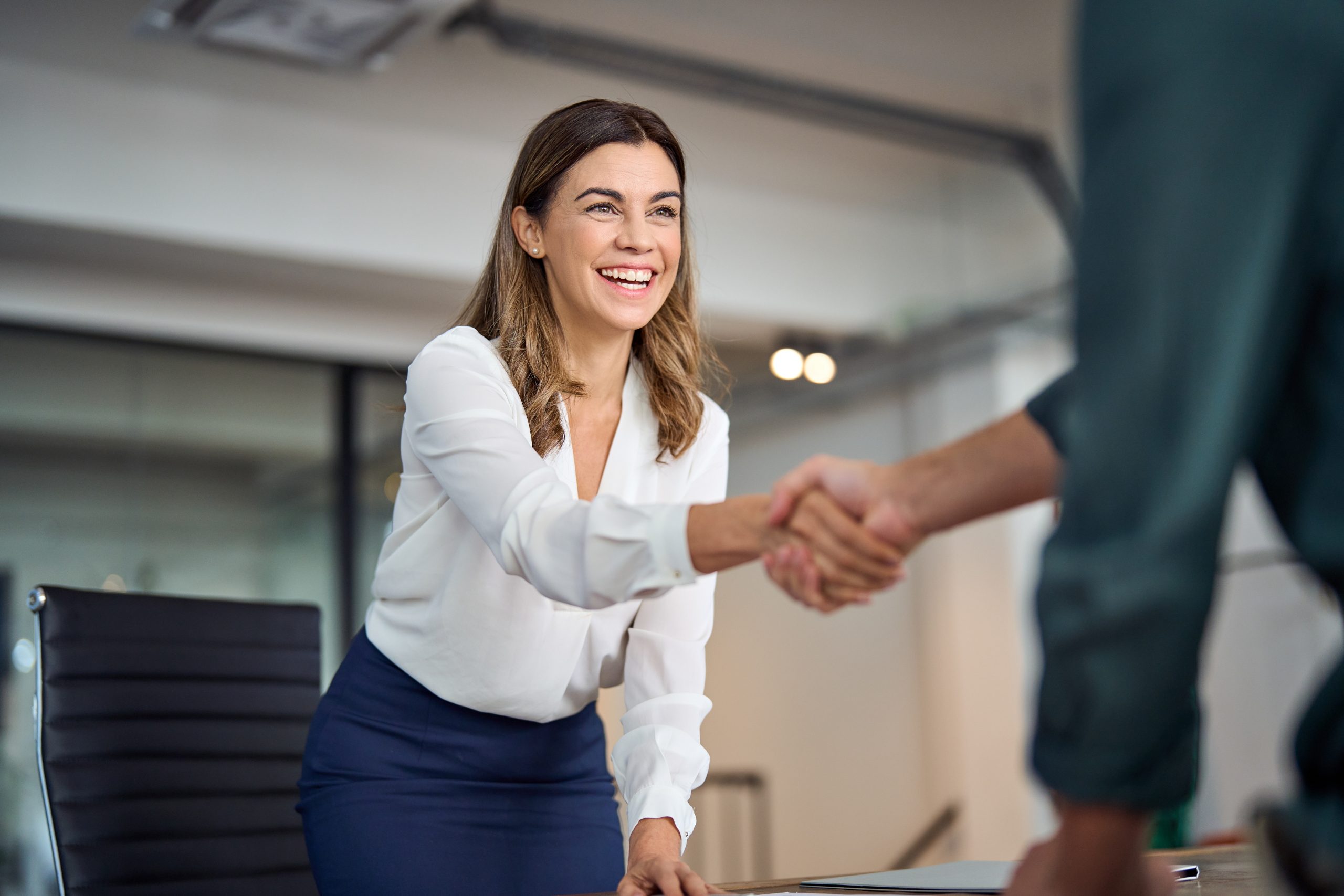 Happy,Mid,Aged,Business,Woman,Manager,Handshaking,Greeting,Client,In